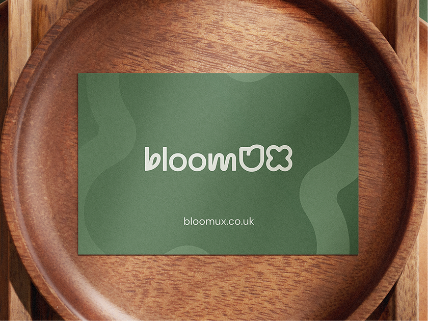 BloomUX Business card on wooden plate